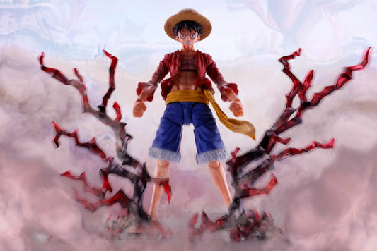 One Piece: S.H.Figuarts: Monkey.D.Luffy – figure flanked by red thorn effect parts